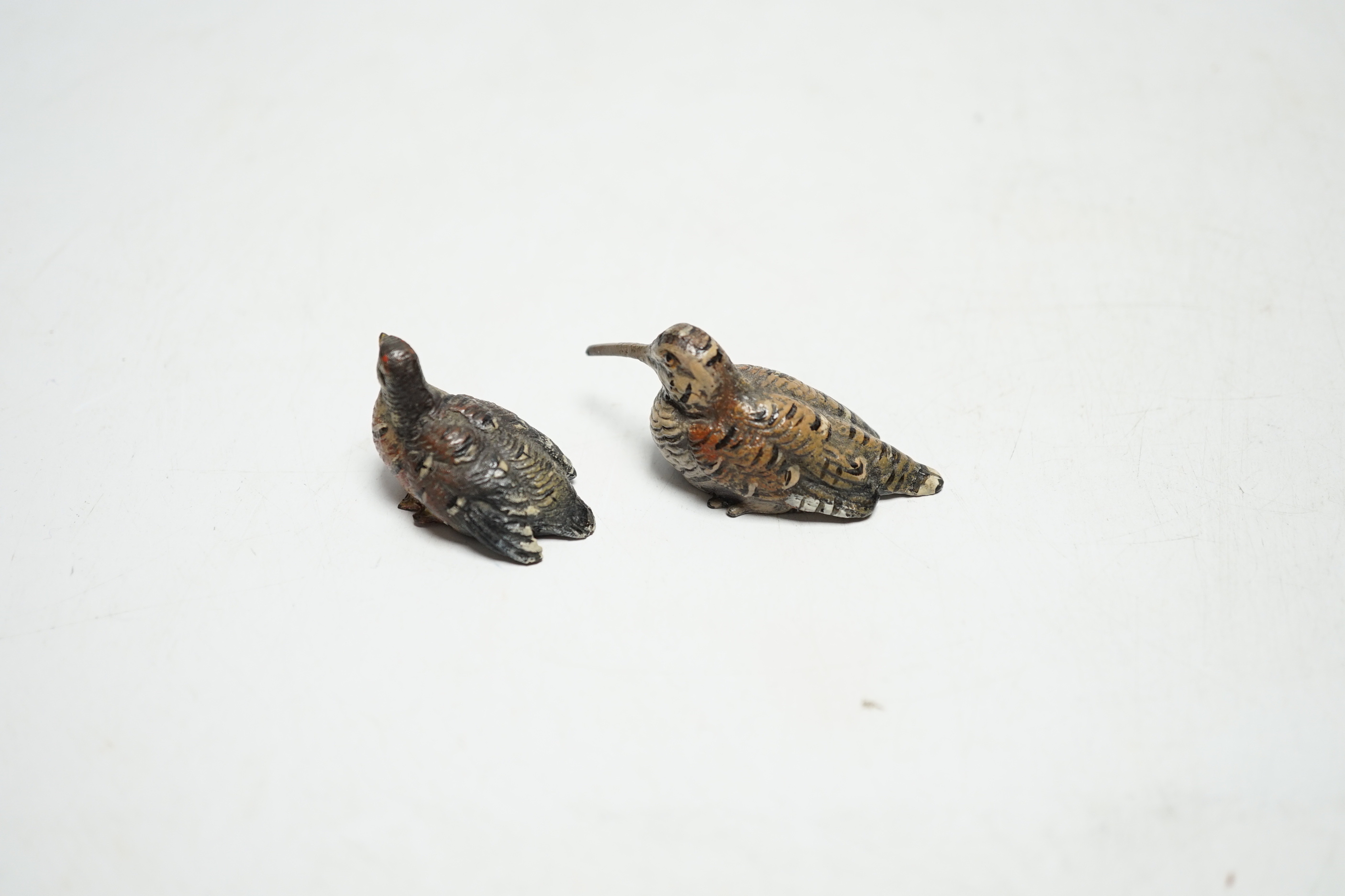 Two miniature Austrian cold painted bronze models of a snipe and partridge, longest 5cm